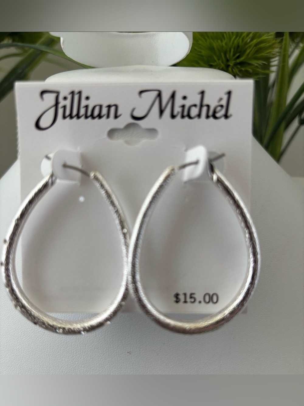 Jillian Michele silvertone  teardrop shape hoop w/clear tiny rhinestones